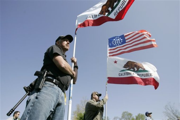Unidentified, armed protesters from Southern California join the "Restore the Constitution" rally at Fort Hunt Park in Alexandria, Va., on Monday.